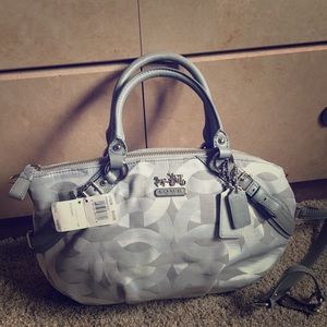 Grey Coach handbag with crossbody straps